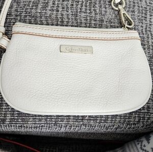 Adorable Calvin Klien ivory colored clutchwristlet , perfect for  many occasions